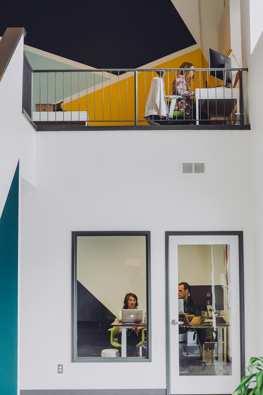 a couple of people sitting at a table in a room