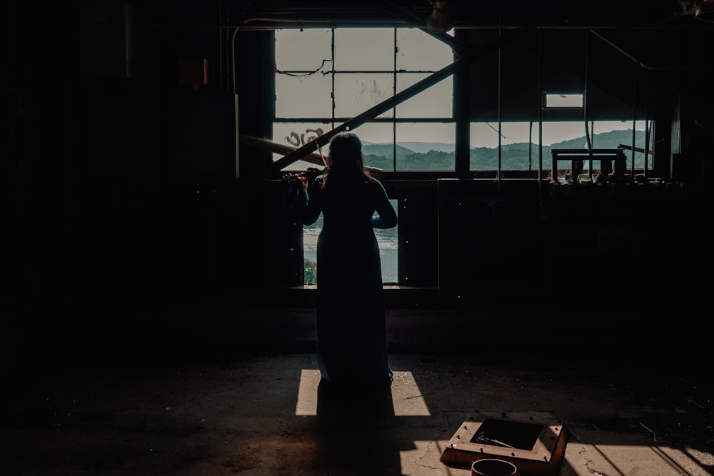 woman standing infront of window