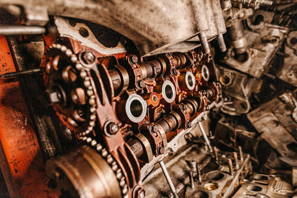 selective focus photography of gray and brass-colored metal parts