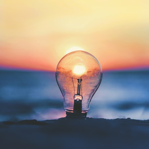 selective focus photography of light bulb