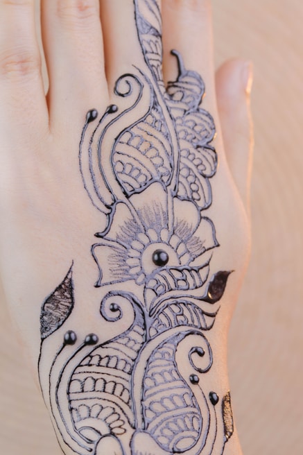 An artistic henna design on a bride's hand, reflecting traditional beauty.