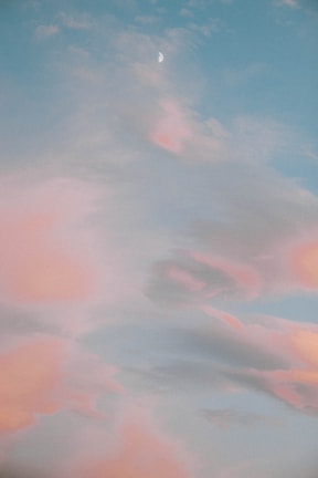 A serene morning journal setup with soft pastel colors and a moon motif.