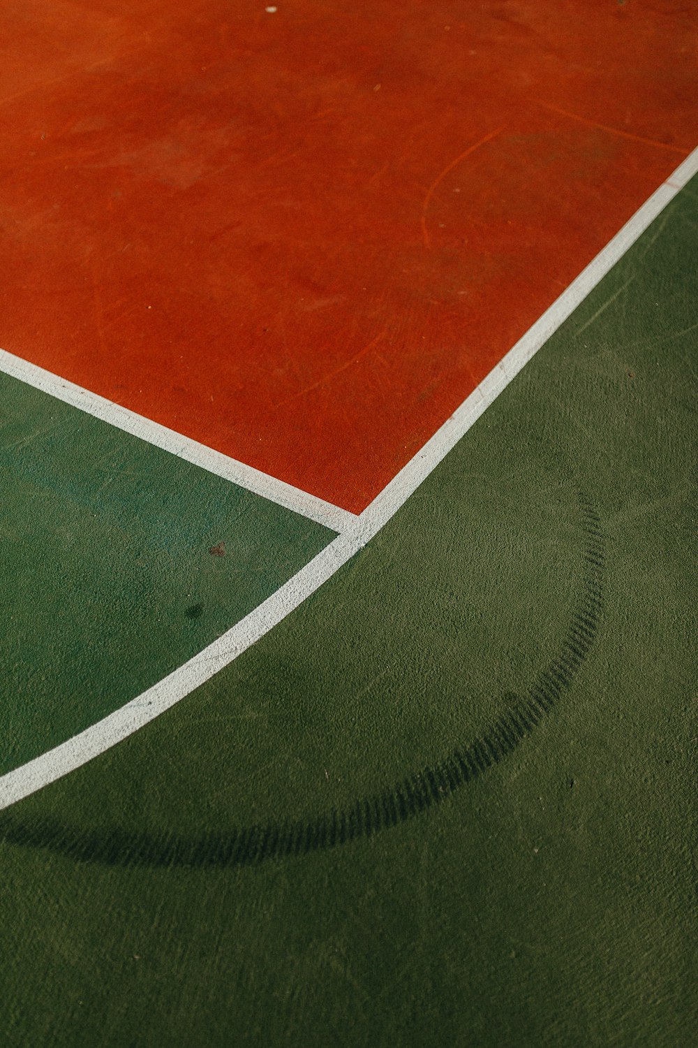 a tennis court with a red and green court