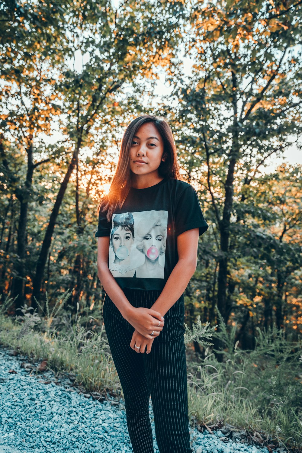 woman standing on unpaved road