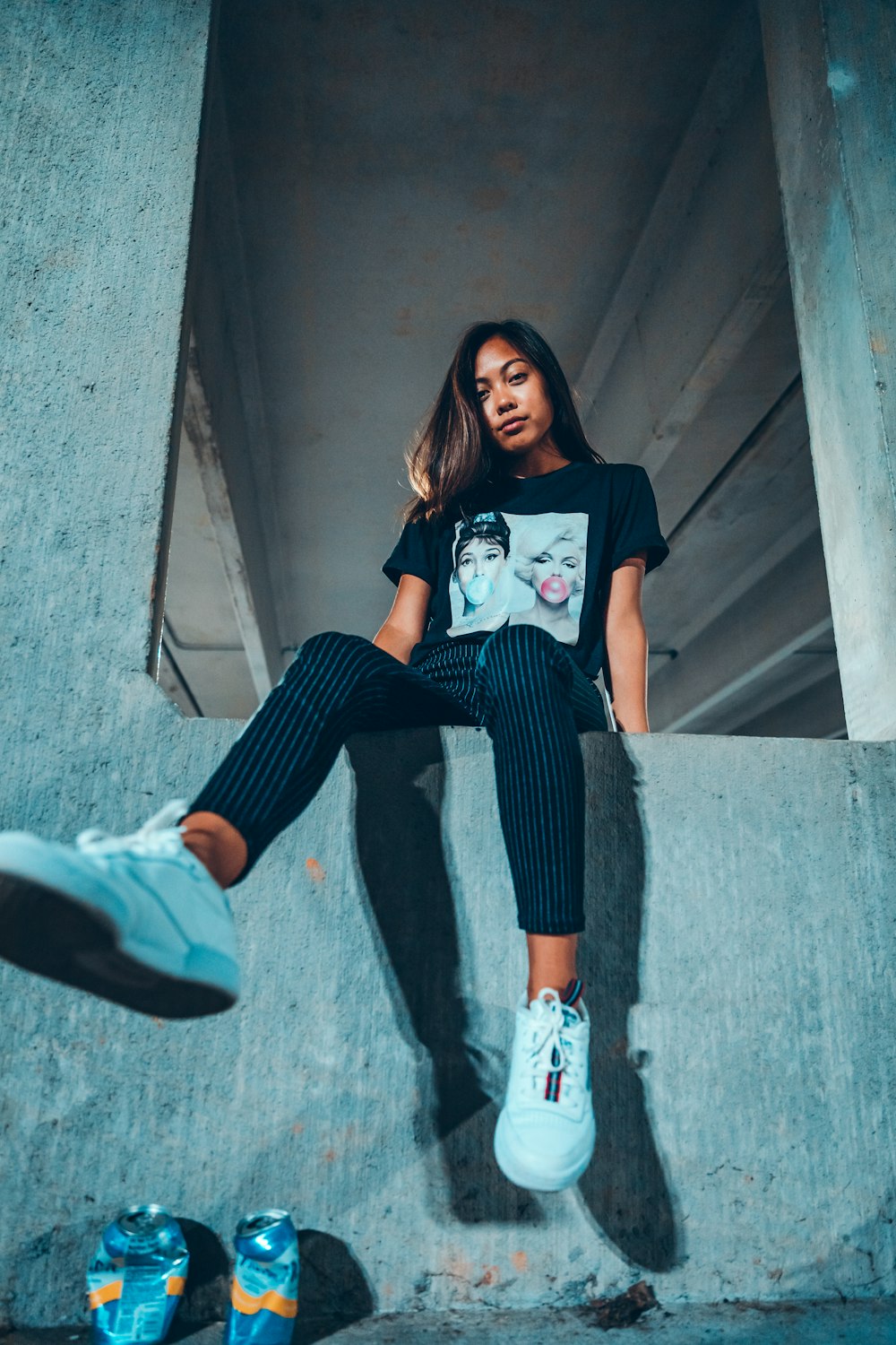 sitting woman wearing black and white crew-neck t-shirt