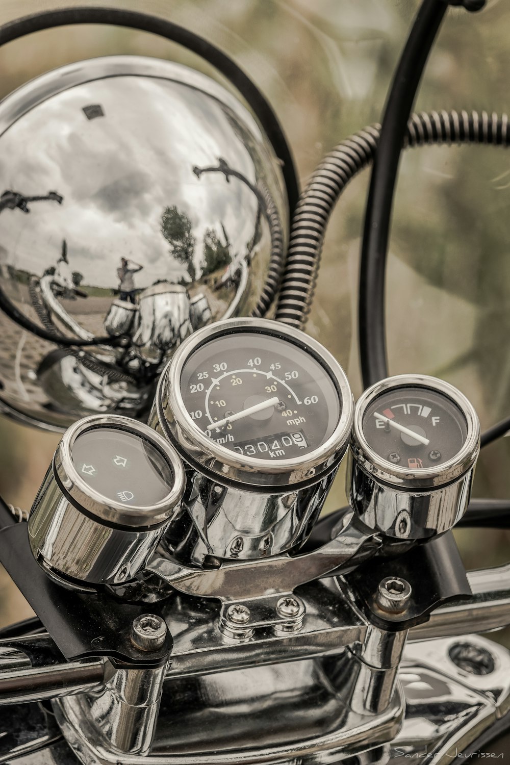 a close up of the gauges on a motorcycle