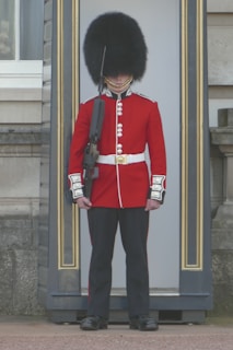 Close-up of a Roblox character dressed in the iconic red tunic and bearskin hat of the Grenadier Guards.