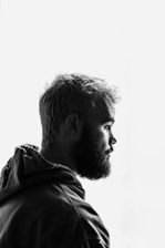 grayscale photo of man facing right