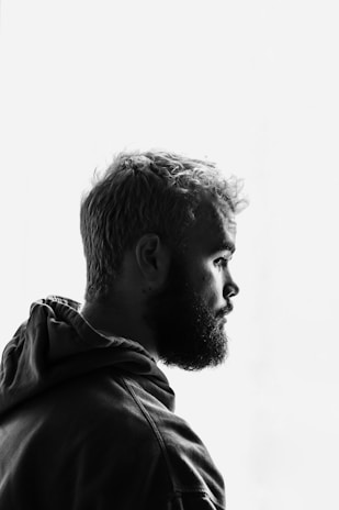 grayscale photo of man facing right