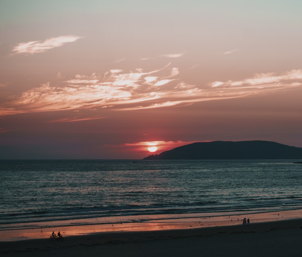 blue sea viewing mountain during sunset