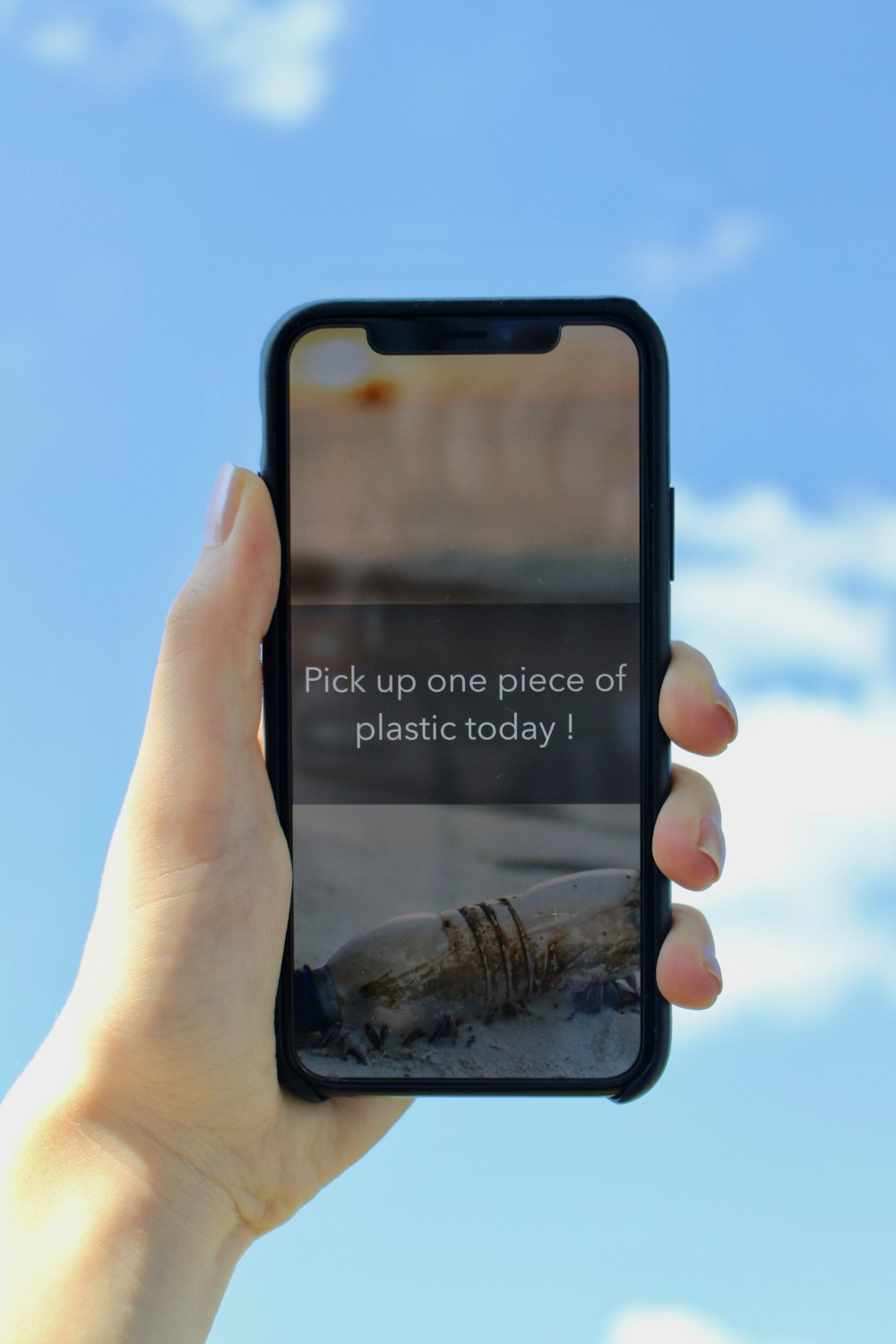 person holds black smartphone