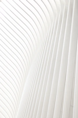 a man riding a skateboard on top of a white wall