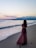 woman standing on seashore during day