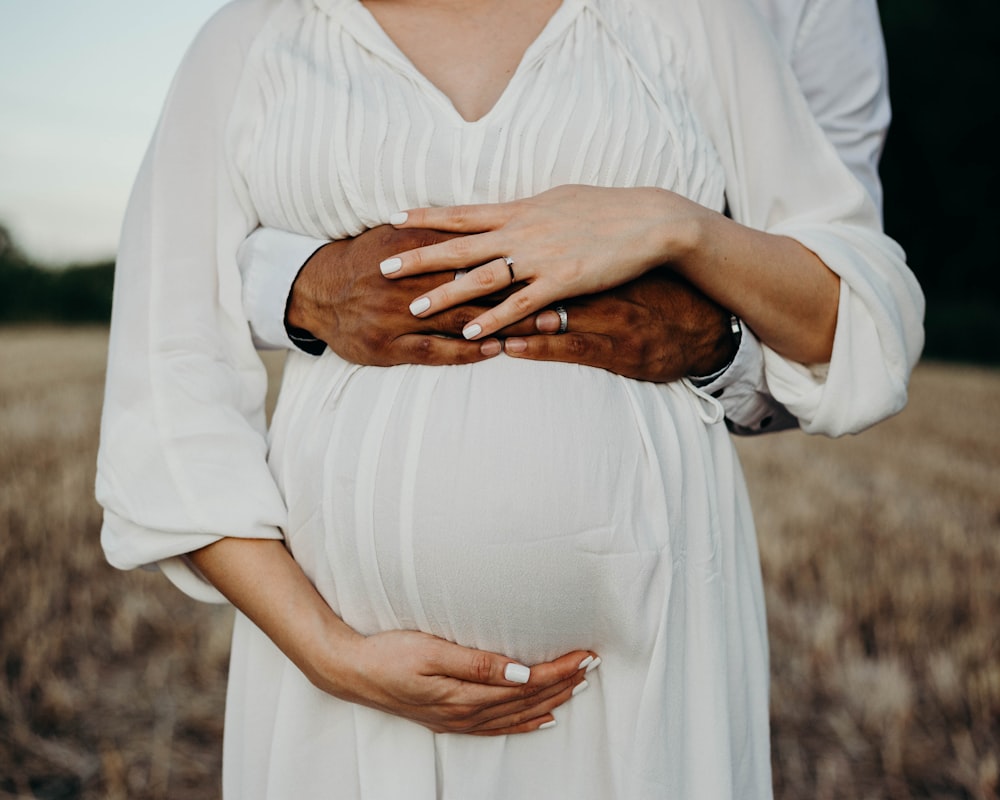 pregnant woman wearing white dress