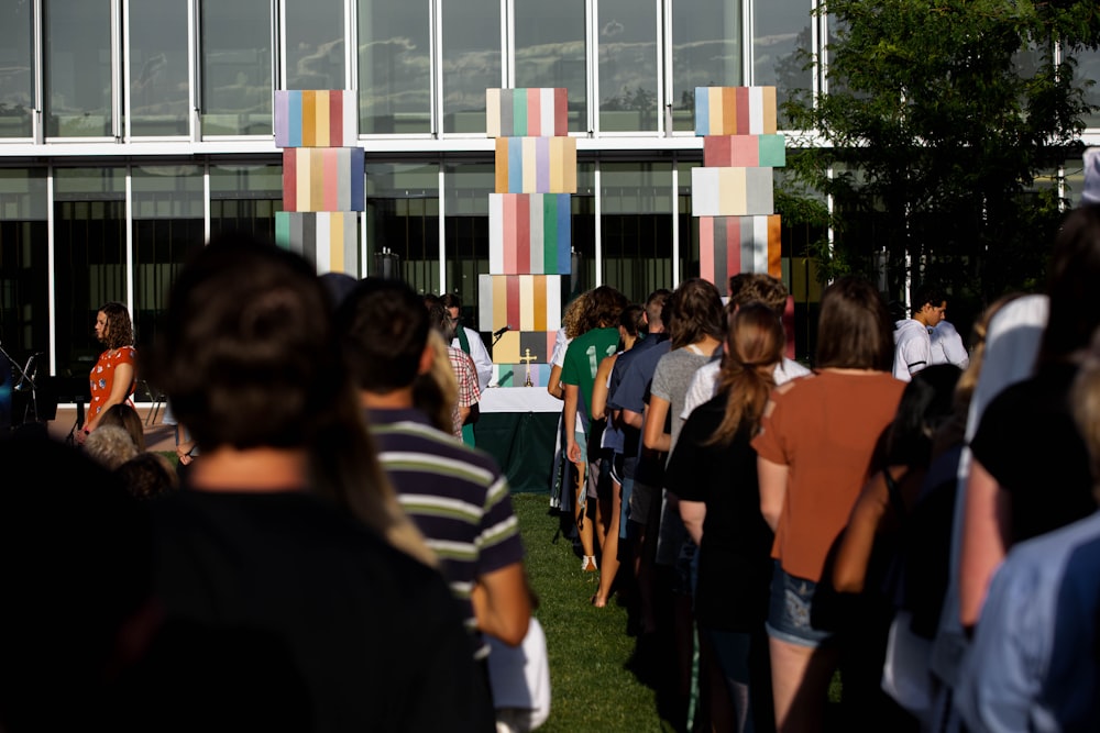 people standing front of buildings at daytime