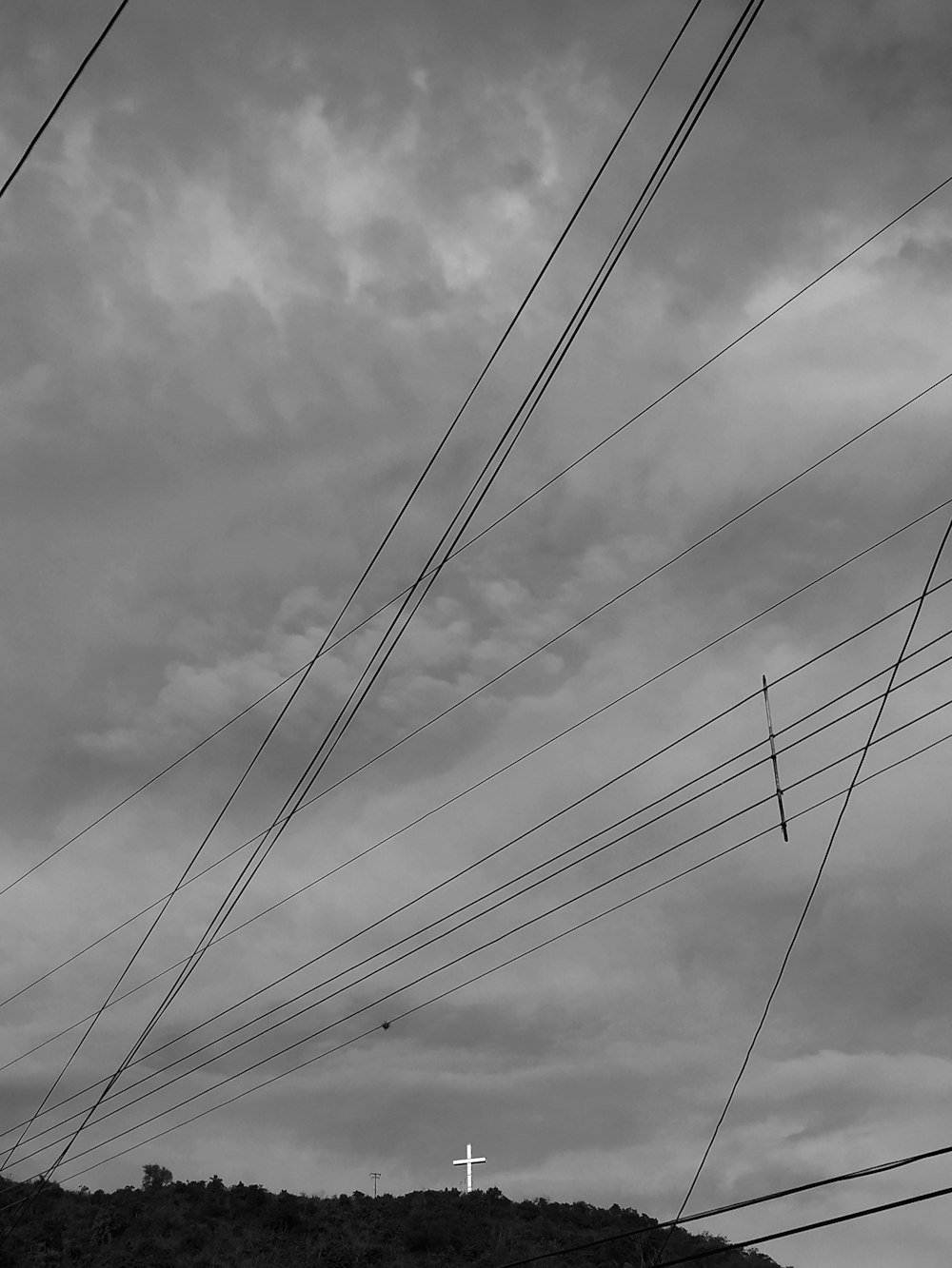 eleectric cables under cloudy sky