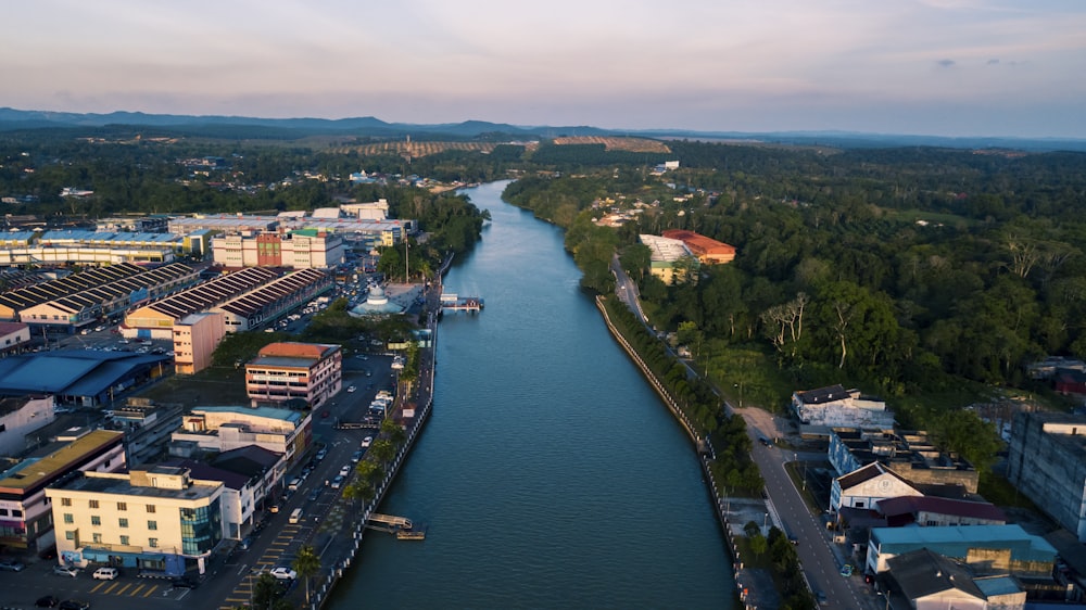 an aerial view of a river running through a city