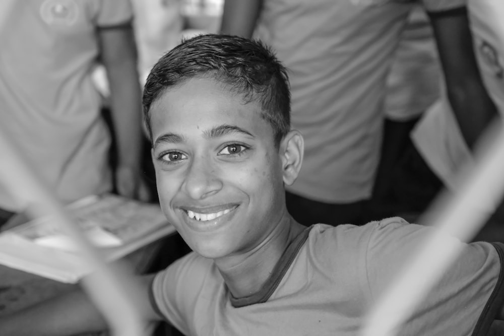 grayscale photo of a man in a crew neck shirt