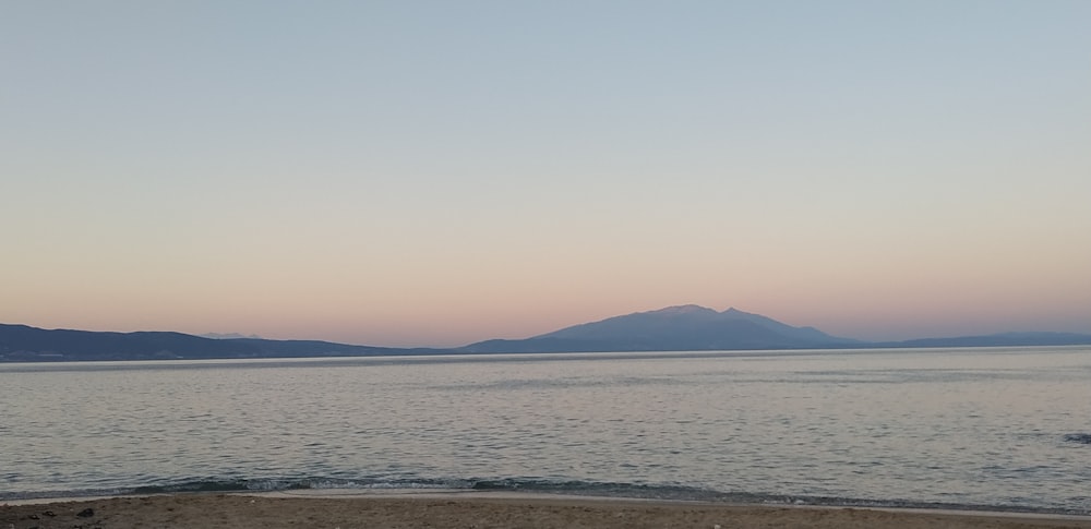 body of water near mountain