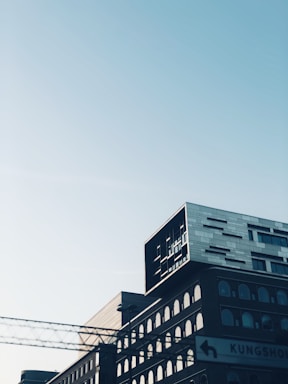 Front view of a modern law office building in Madrid with clear signage.