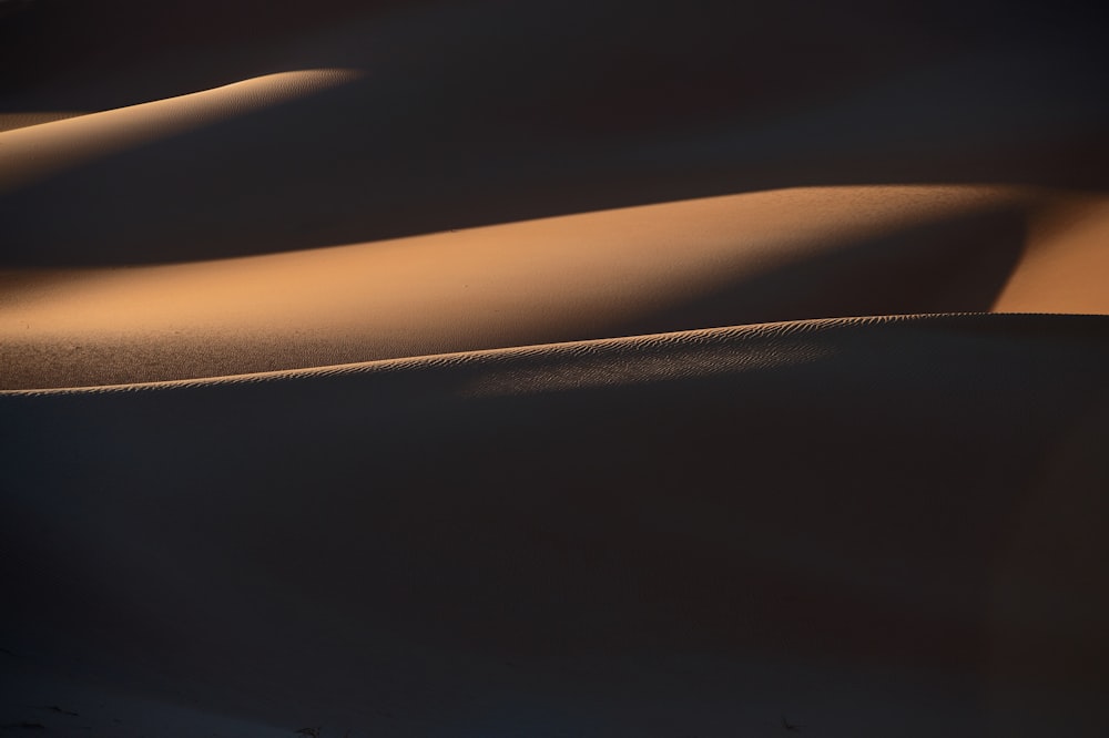 a sand dune in the middle of the desert