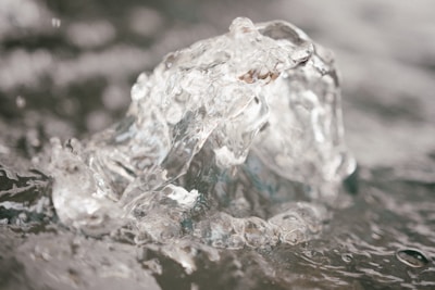 Close-up of clear water flowing from a modern Enagic Kangen machine.