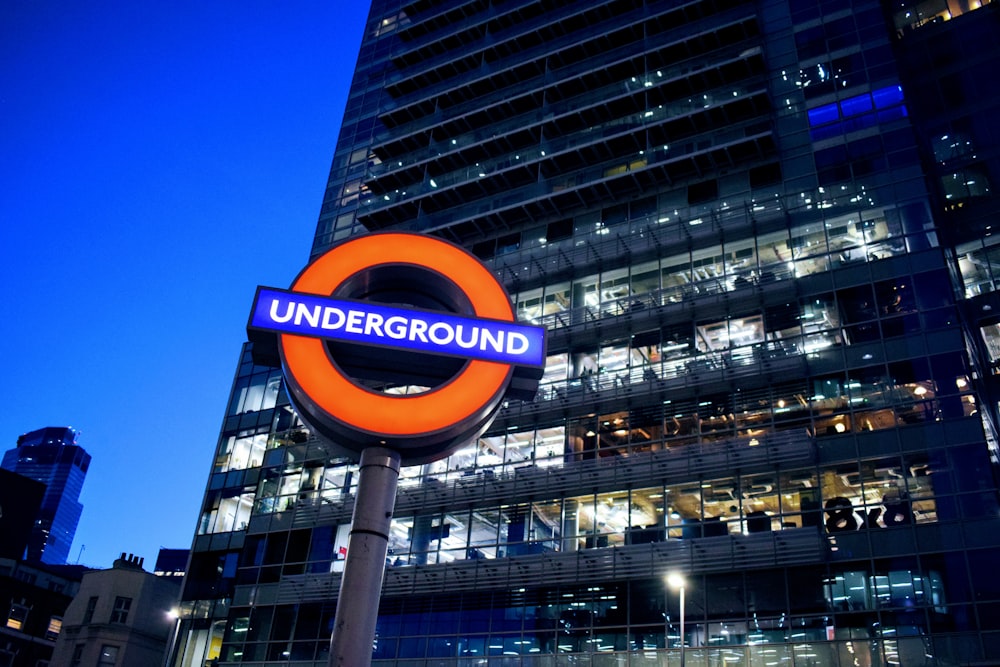 orange and blue Underground signboard