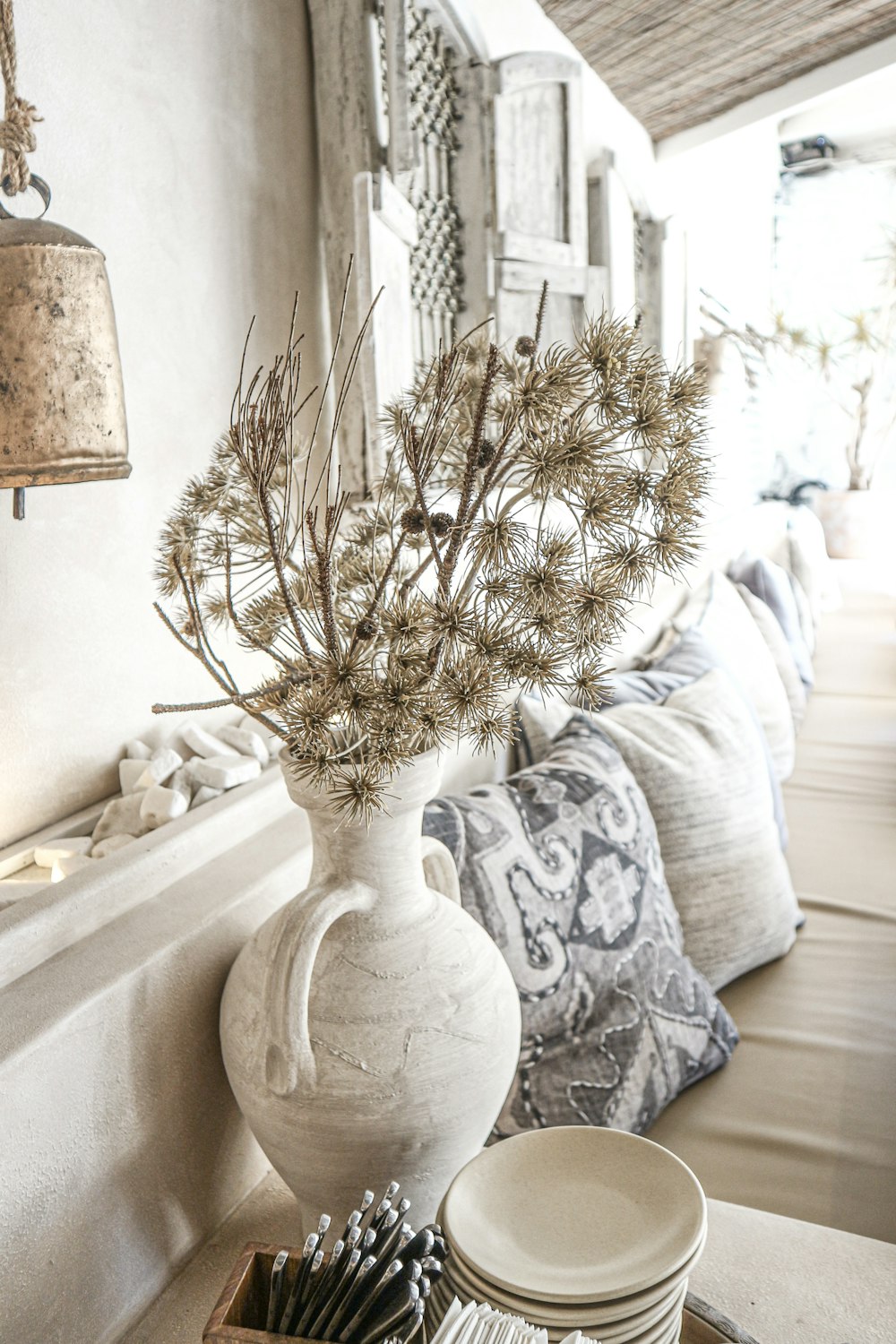 white flowers with white vase