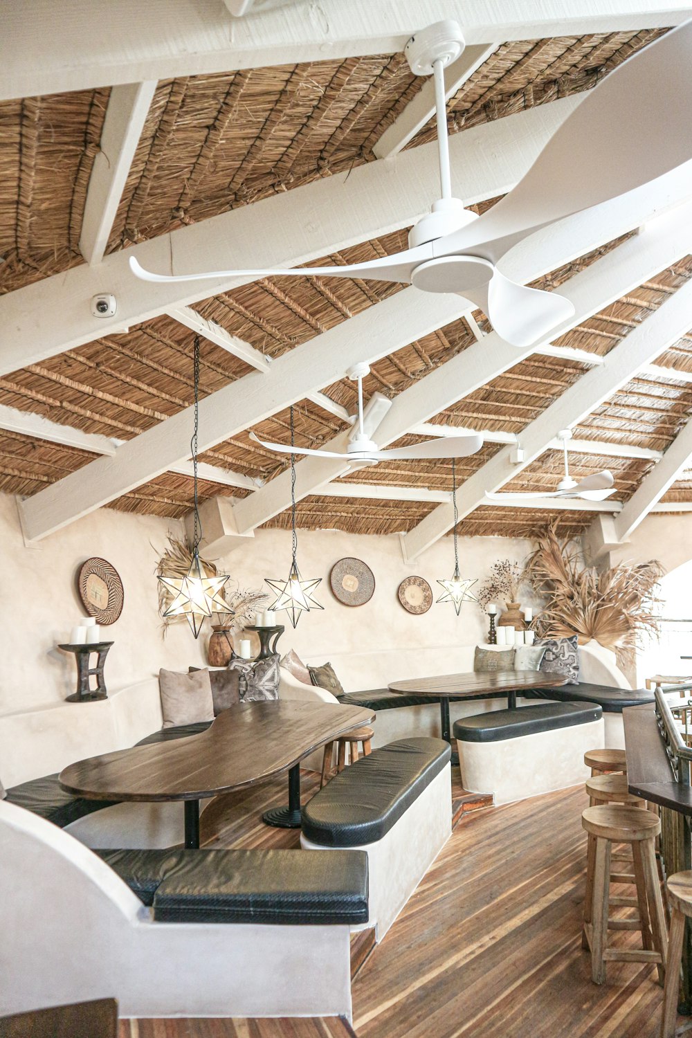 brown wooden table and black benches