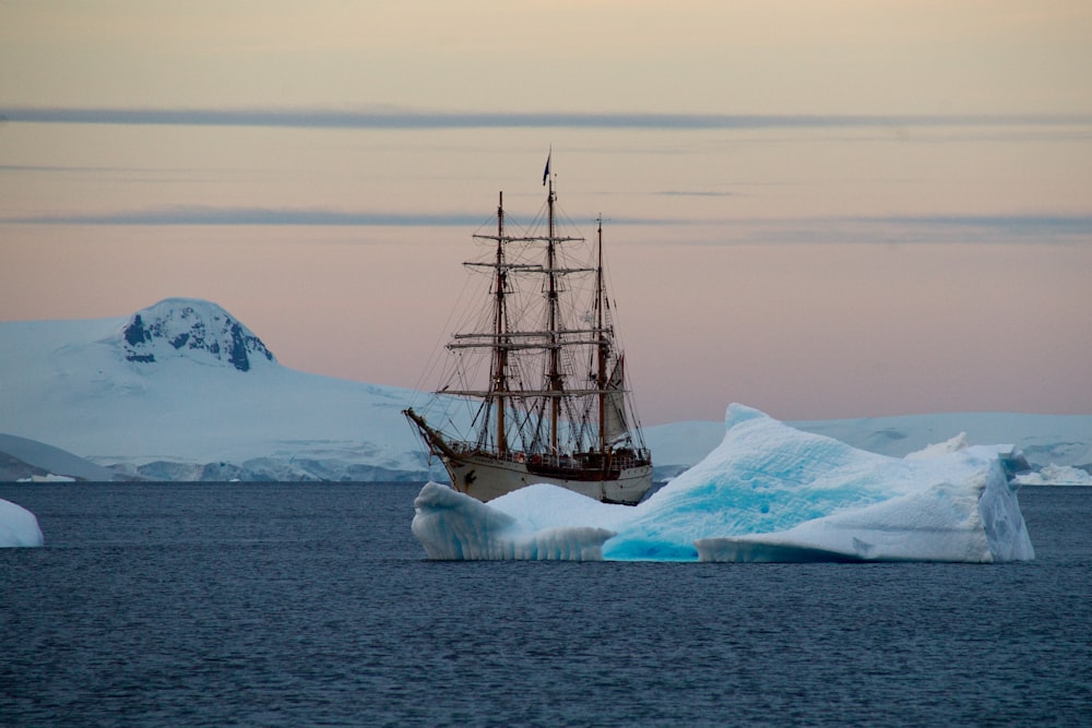 brown ship on body of water during daytime