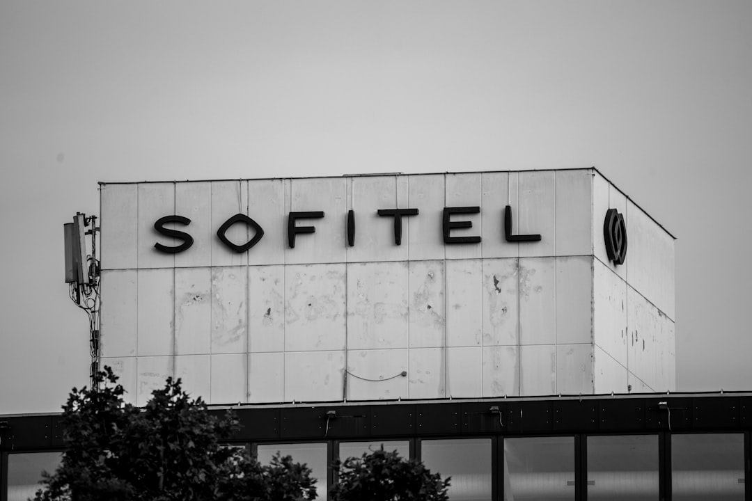 grayscale photo of black and white Sofitel building