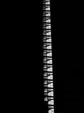 A sleek, dark-themed architectural blueprint glowing subtly against a black background.