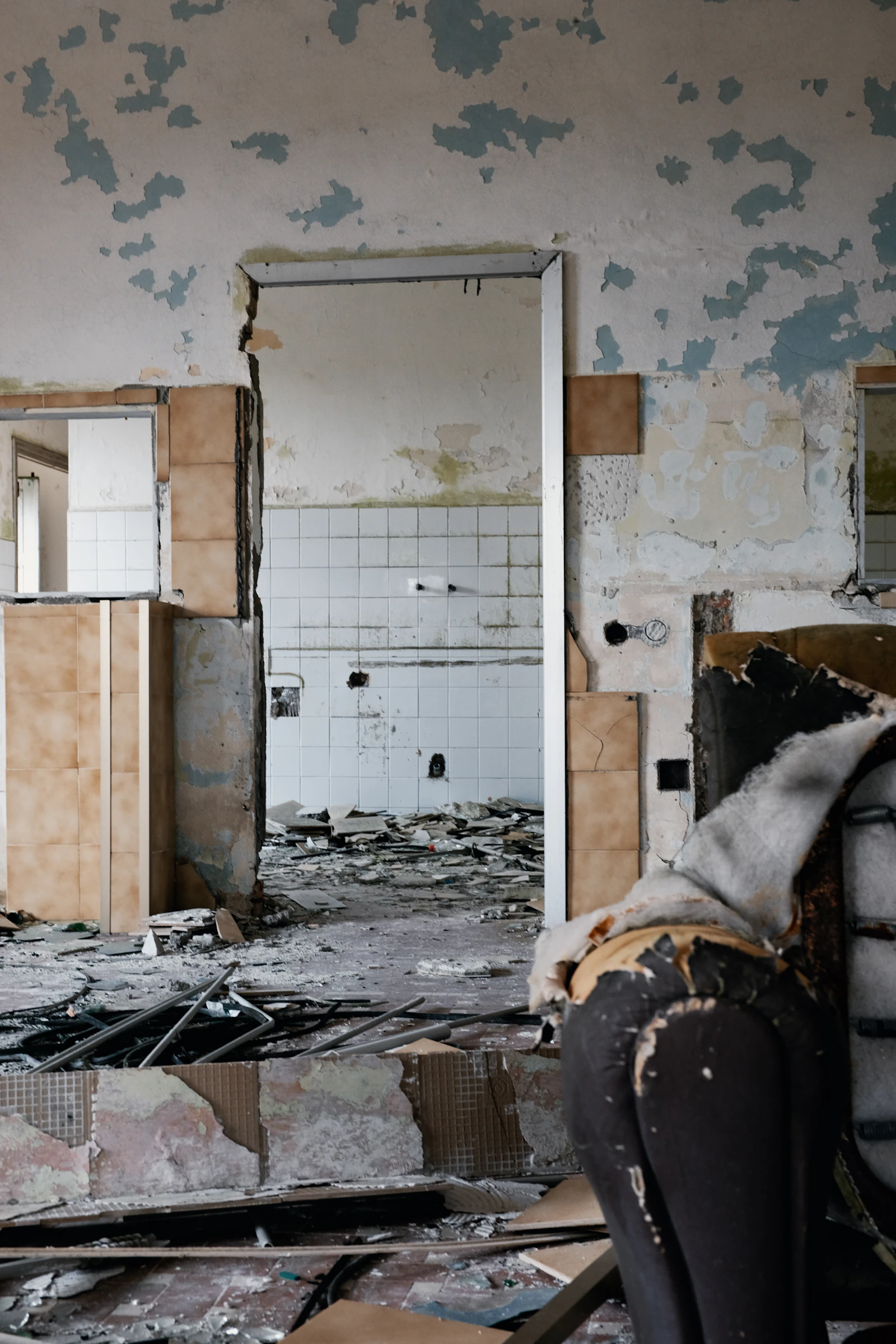 A room mid-restoration, with damaged materials being removed