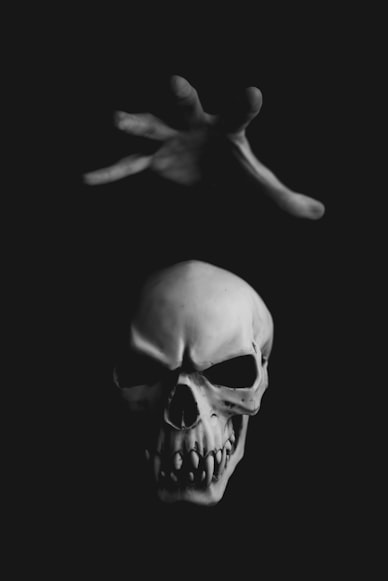 Person doing spell with evil skull