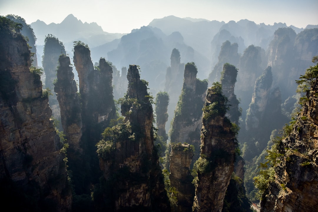 Misty sandstone pillars rising above clouds at Zhangjiajie National Park