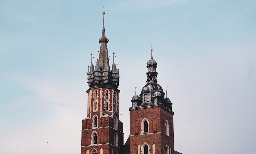 two towers of a building with a sky background