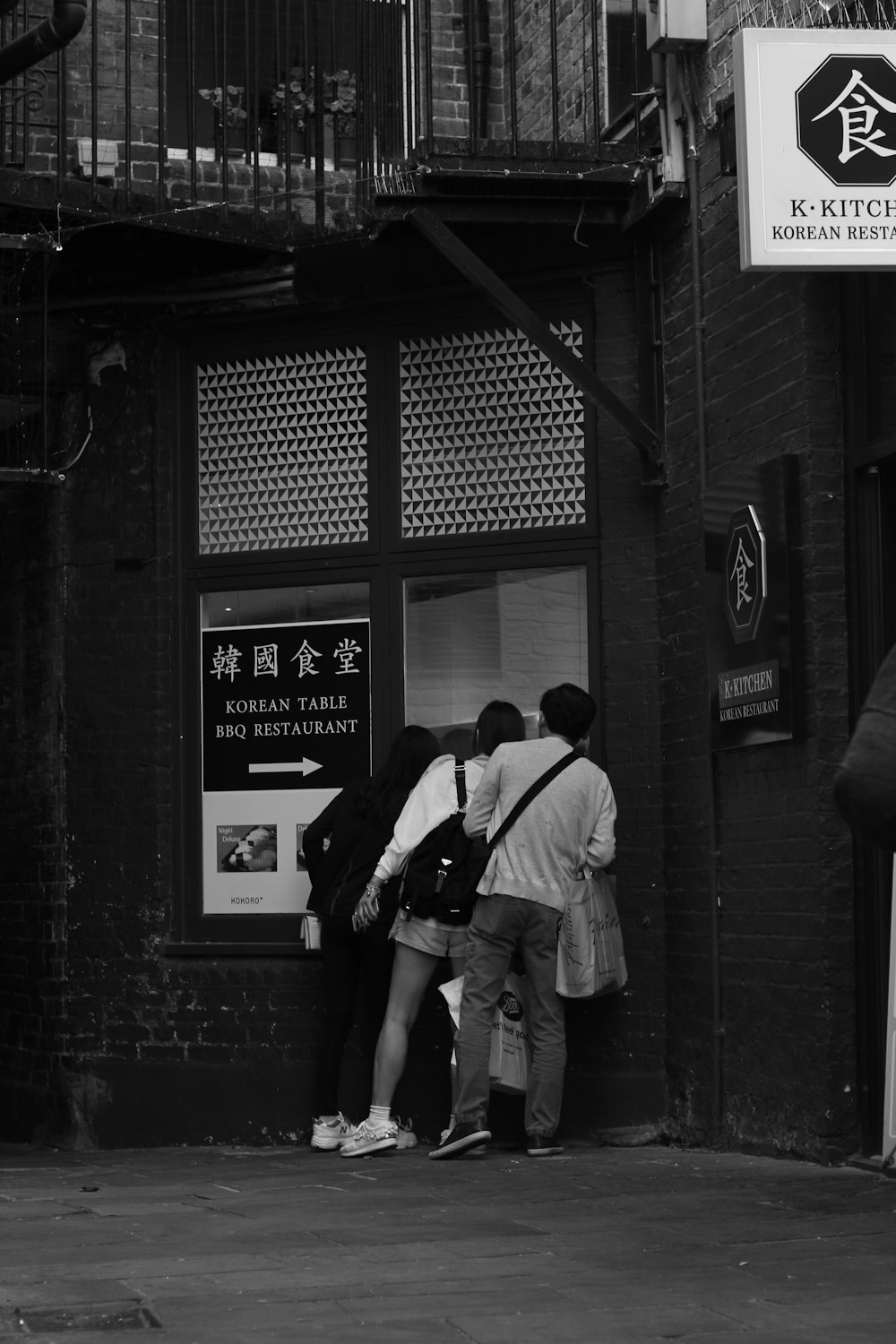 man and woman looking at the door