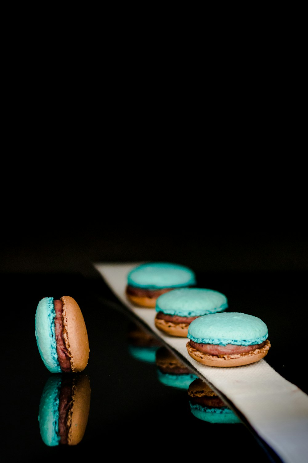 four blue-and-brown cookies