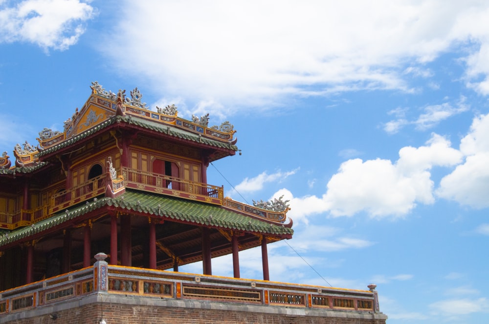 red concrete temple at daytime