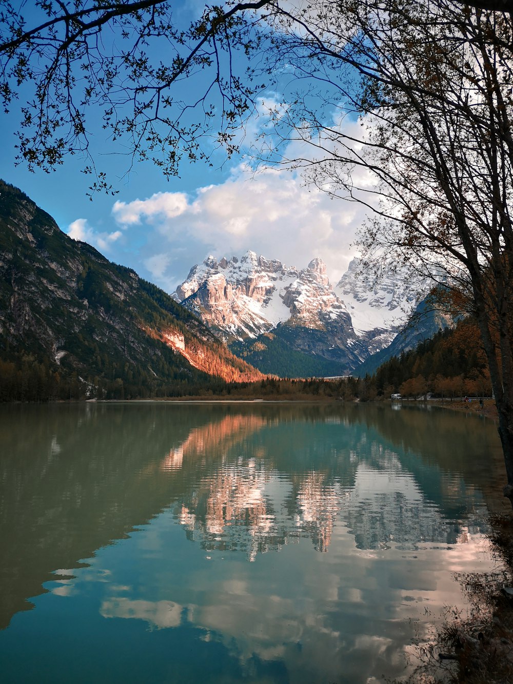 lake and brown mountains during daytime