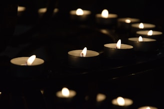Softly lit candles arranged in a circle, creating a warm and inviting atmosphere for special events.