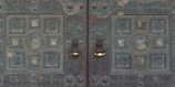 Custom metal door with intricate patterns freshly welded and polished