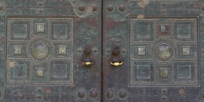 Custom metal door with intricate patterns freshly welded and polished