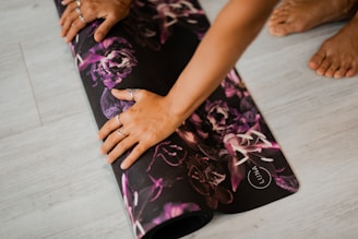 woman unrolling a yoga mat