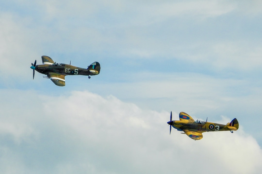 yellow and gray monoplane,