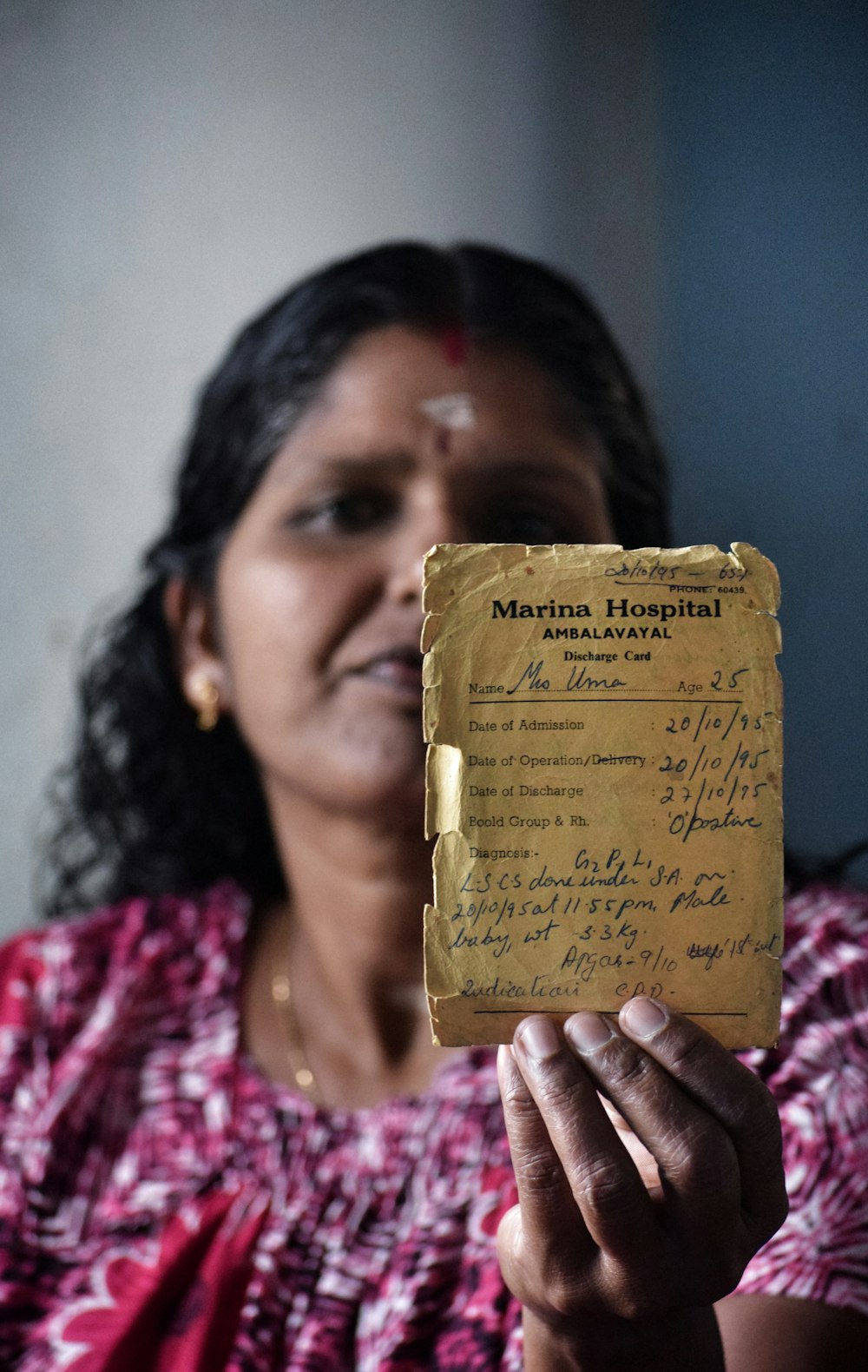 woman holding beige book