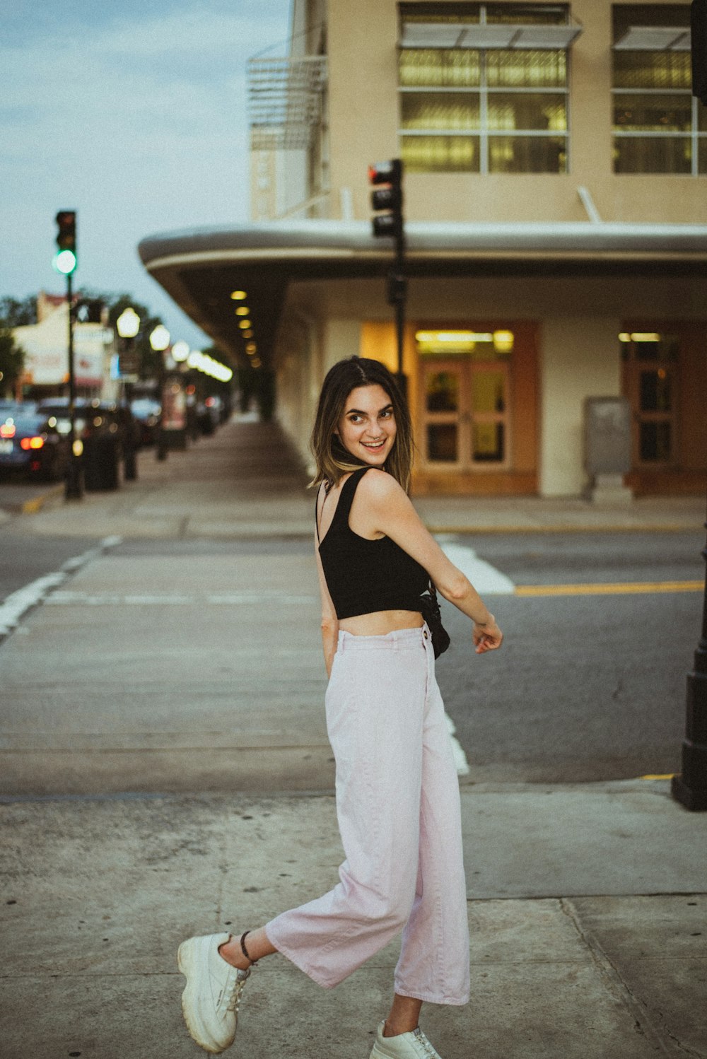 woman walking near road