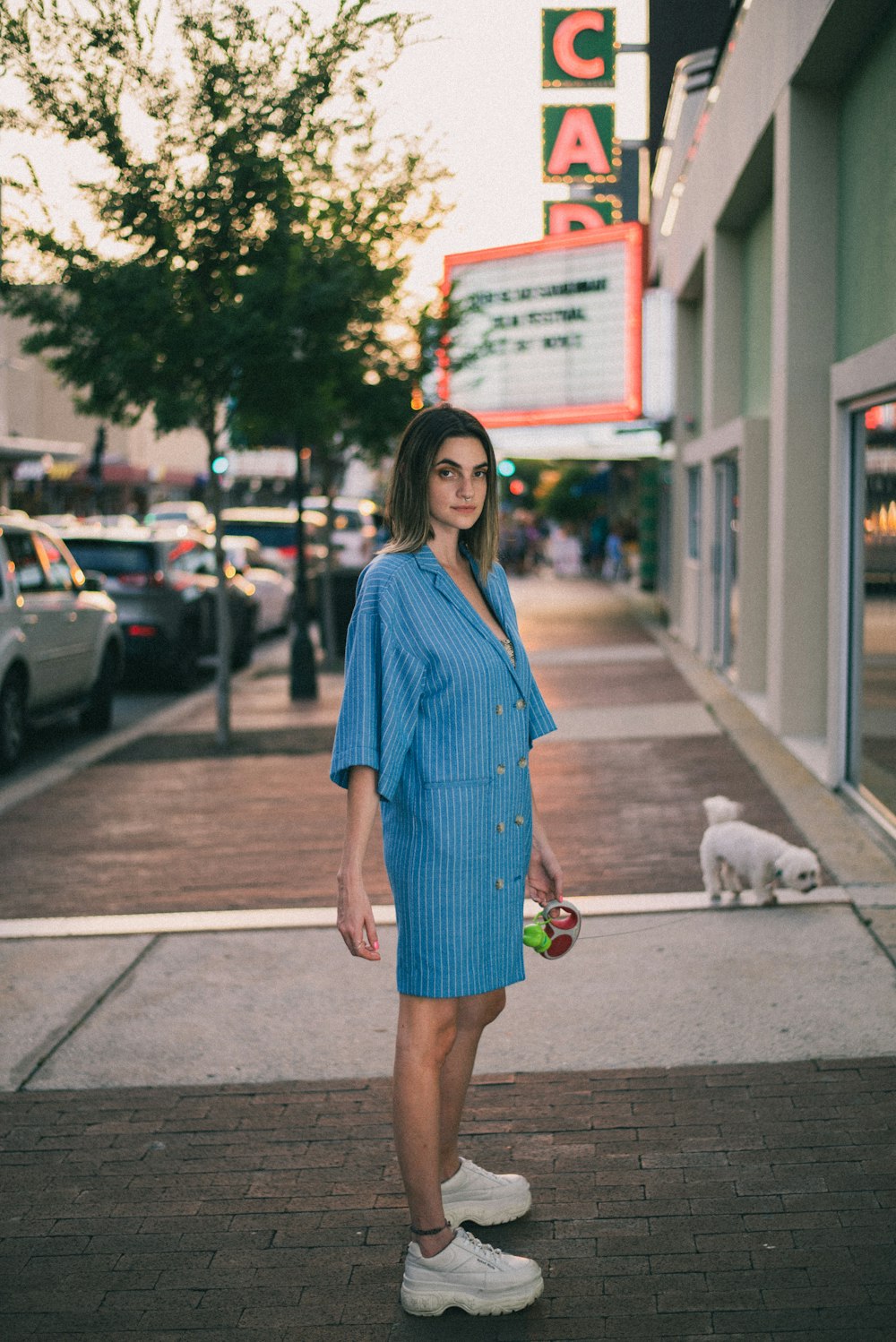 woman standing beside building