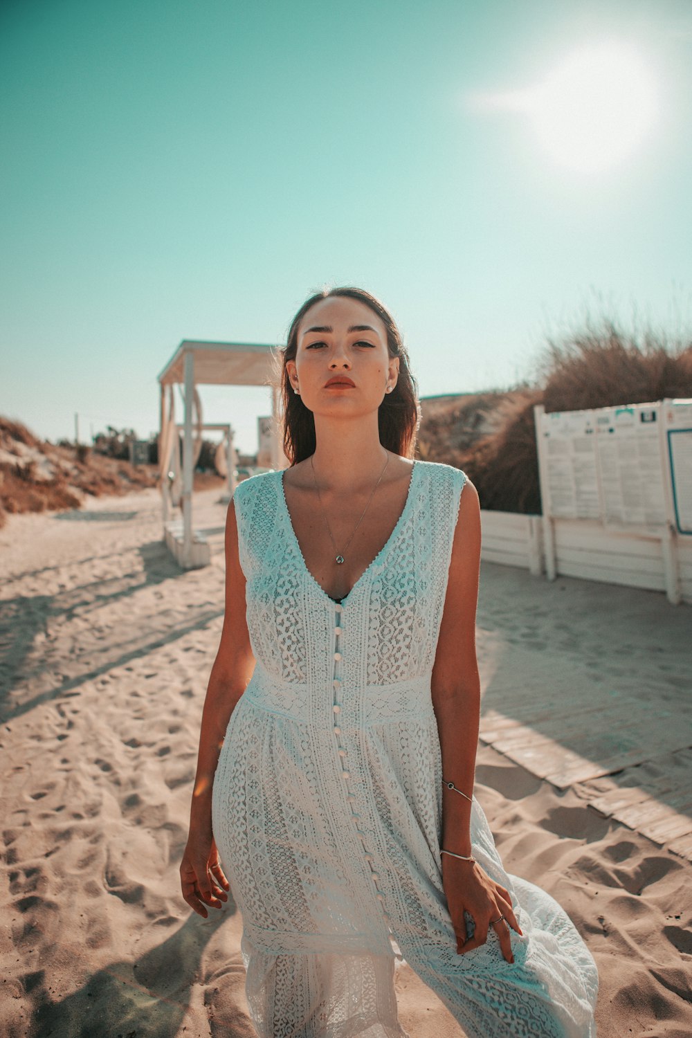 woman wearing white sleeveless dress