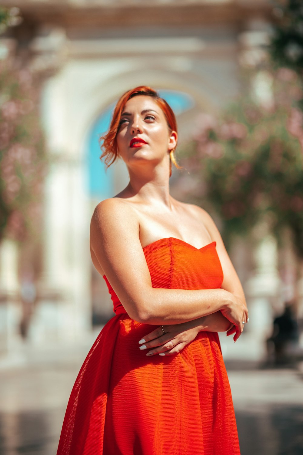 woman in red strapless dress